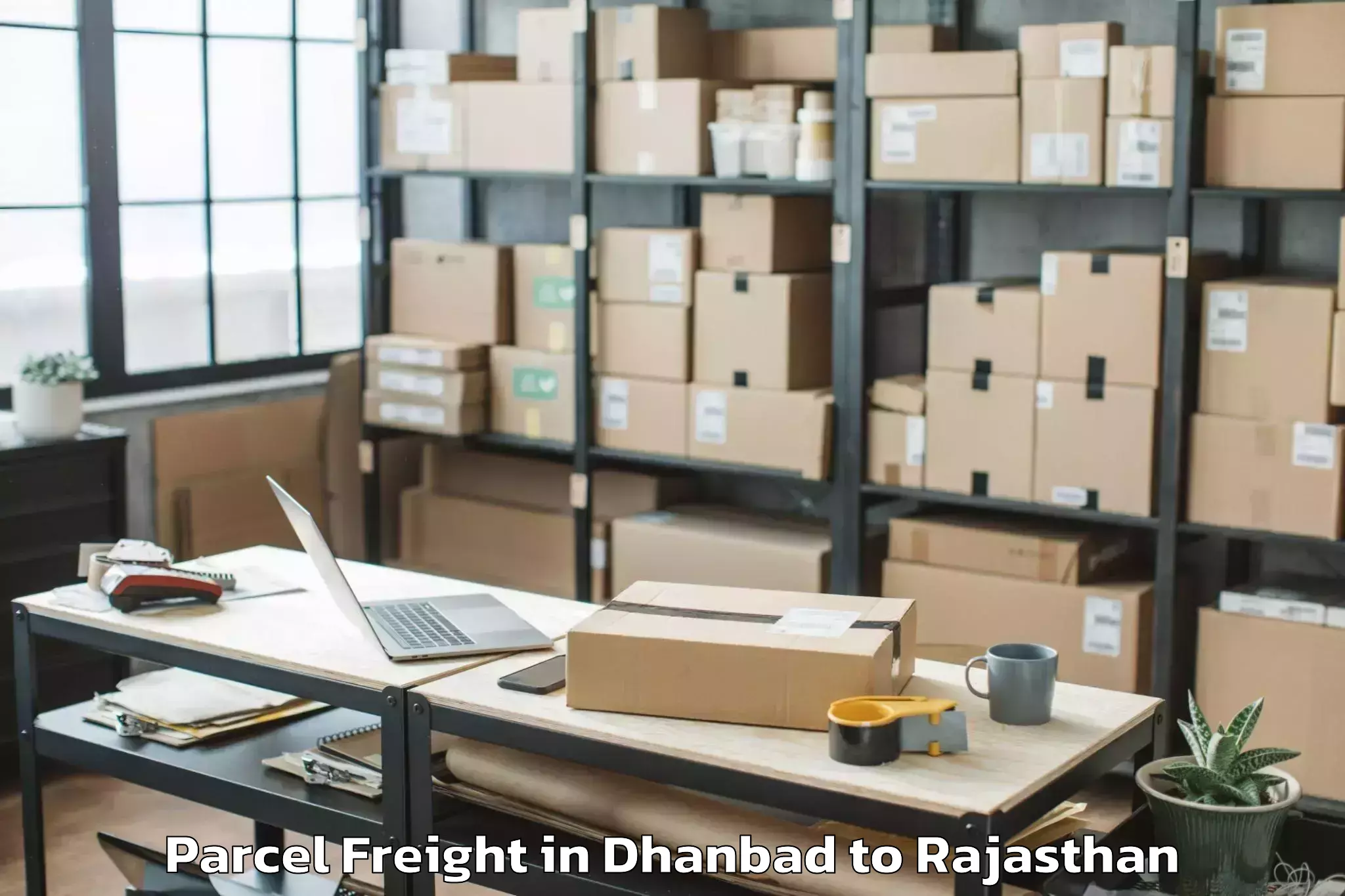 Easy Dhanbad to Maharaja Surajmal Brij Univers Parcel Freight Booking